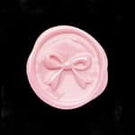 pink wax seal with bow